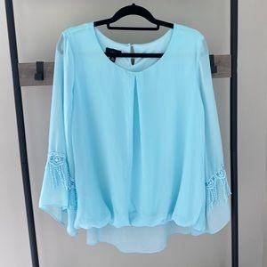 Turquoise women’s blouse